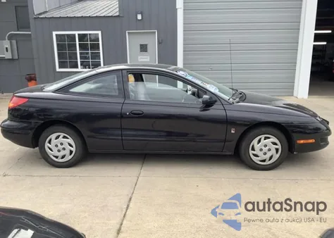 1999 Saturn Sc1 z USA, uszkodzony, nr VIN 1G8ZP1283XZ324457